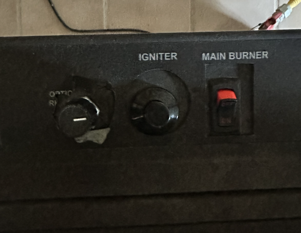 Close-up of a control panel featuring a knob labeled 
